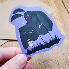 Load image into Gallery viewer, Mothman Holding a Lantern Full of Fireflies Sticker